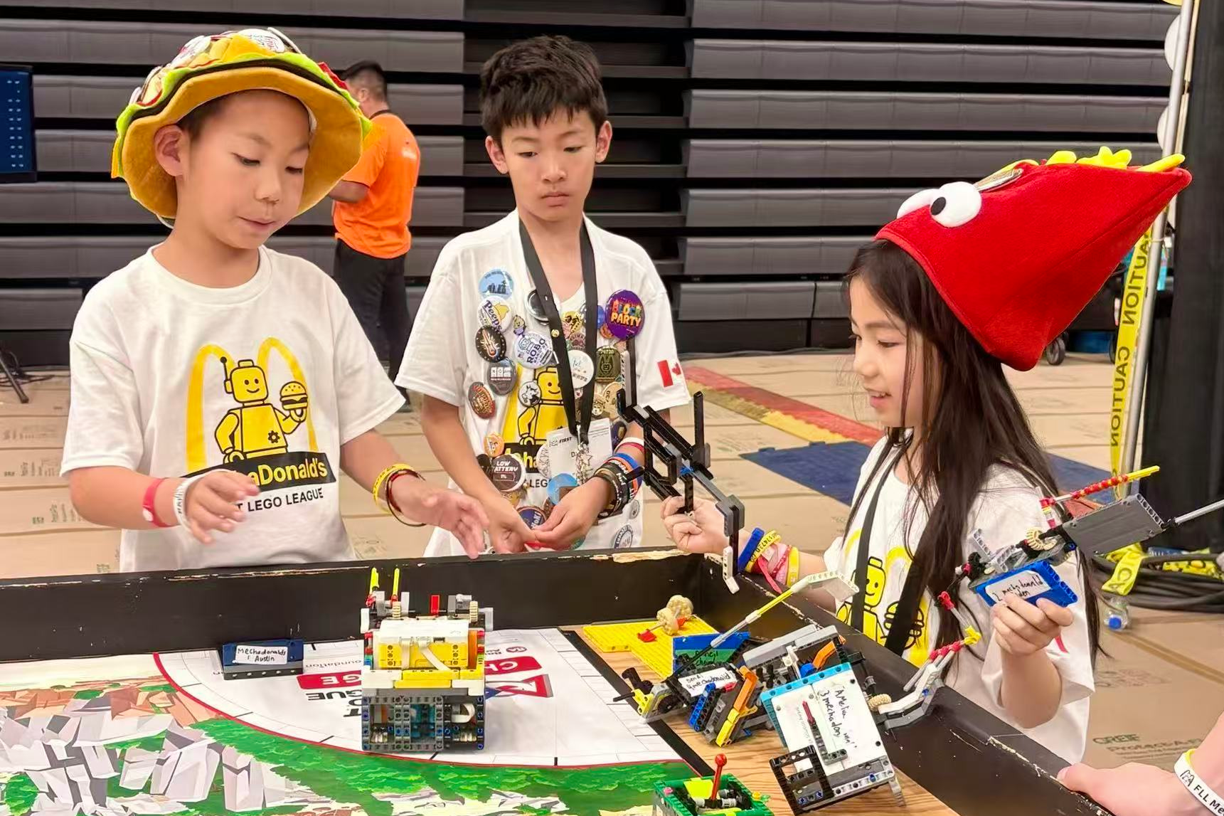 Students tuning a robotics competition robot in a lab
