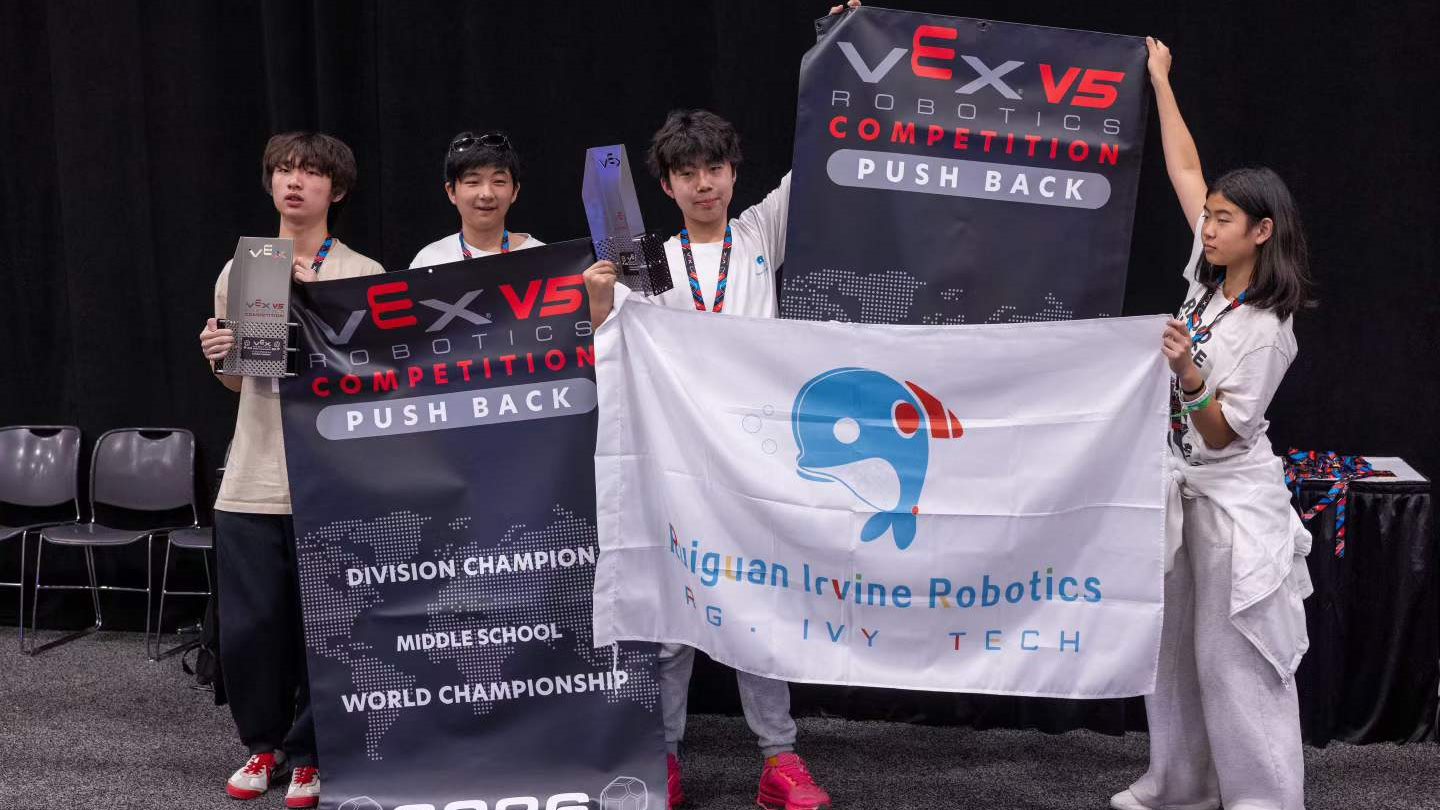 Team holding the VEX V5 Middle School Division Champion banner at the 2026 World Championship